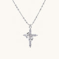 White gold-plated cross pendant adorned with sparkling zirconia stones and crescent moon accent on ball chain