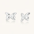 Pair of translucent butterfly-shaped stud earrings with frosted finish and dimensional wing details on white background
