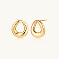Pair of polished 18K gold-plated stainless steel teardrop earrings with hollow centers on cream background