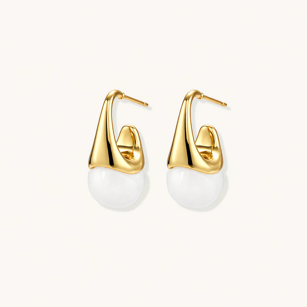 Pair of small gold-plated hoop earrings with triangular cone fronts and curved backs on white background.