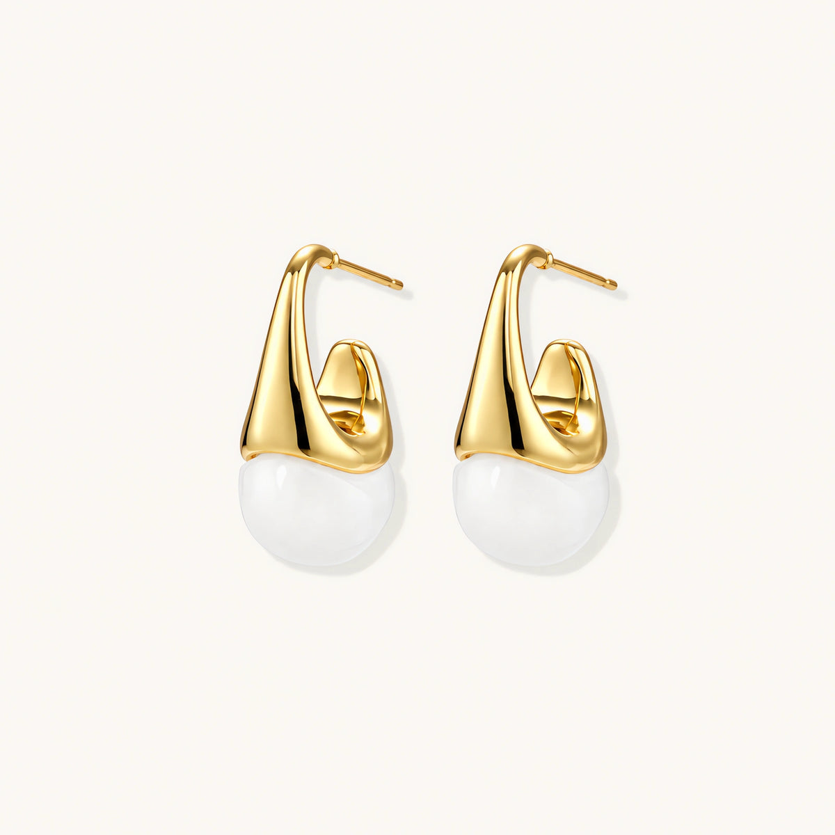 Pair of small gold-plated hoop earrings with triangular cone fronts and curved backs on white background.