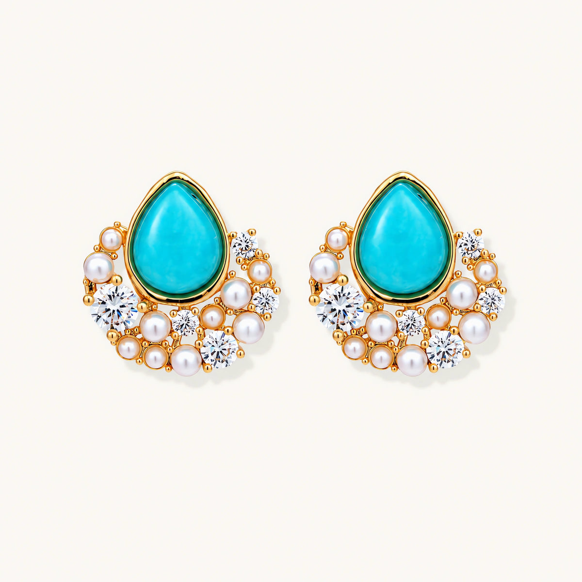 Gold-plated cluster earrings with teardrop turquoise stones surrounded by white pearls and clear crystals