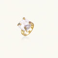 Gold ring with large iridescent baroque pearl and four colored gemstones on textured band